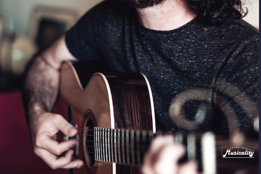 Cover of the sheet music book titled 'New Mexico All-State Guitar Ensemble' featuring a photograph of a person playing a guitar.